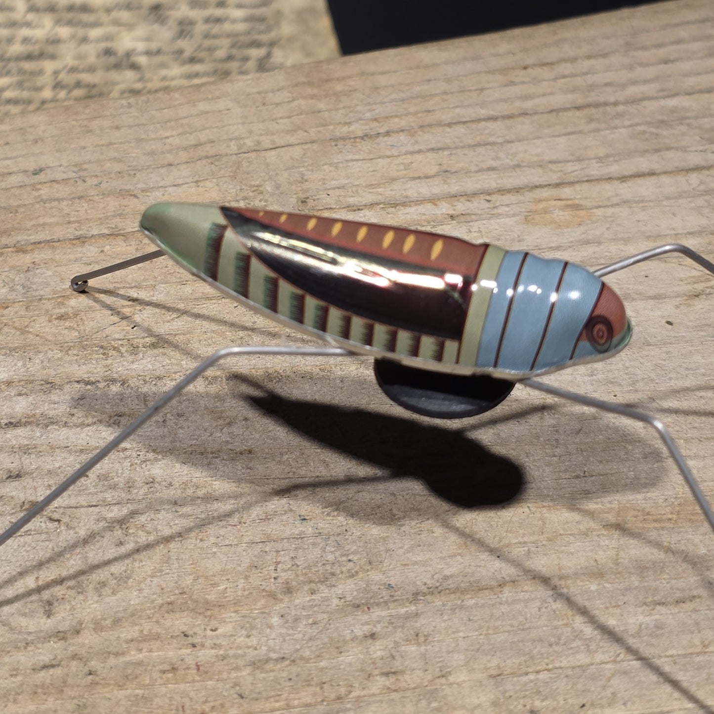 Vintage Style Tin Litho Jumping Grasshopper Toy Suction Cup Hopper Novelty Toy