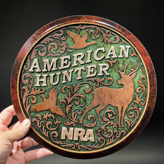 American Hunter NRA Round Metal Sign – Embossed Deer Duck Pheasant Decor