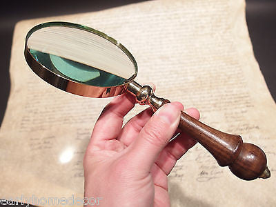 A wooden board and steel made vintage style magnifying glass, complete  handmade, made by artisians High