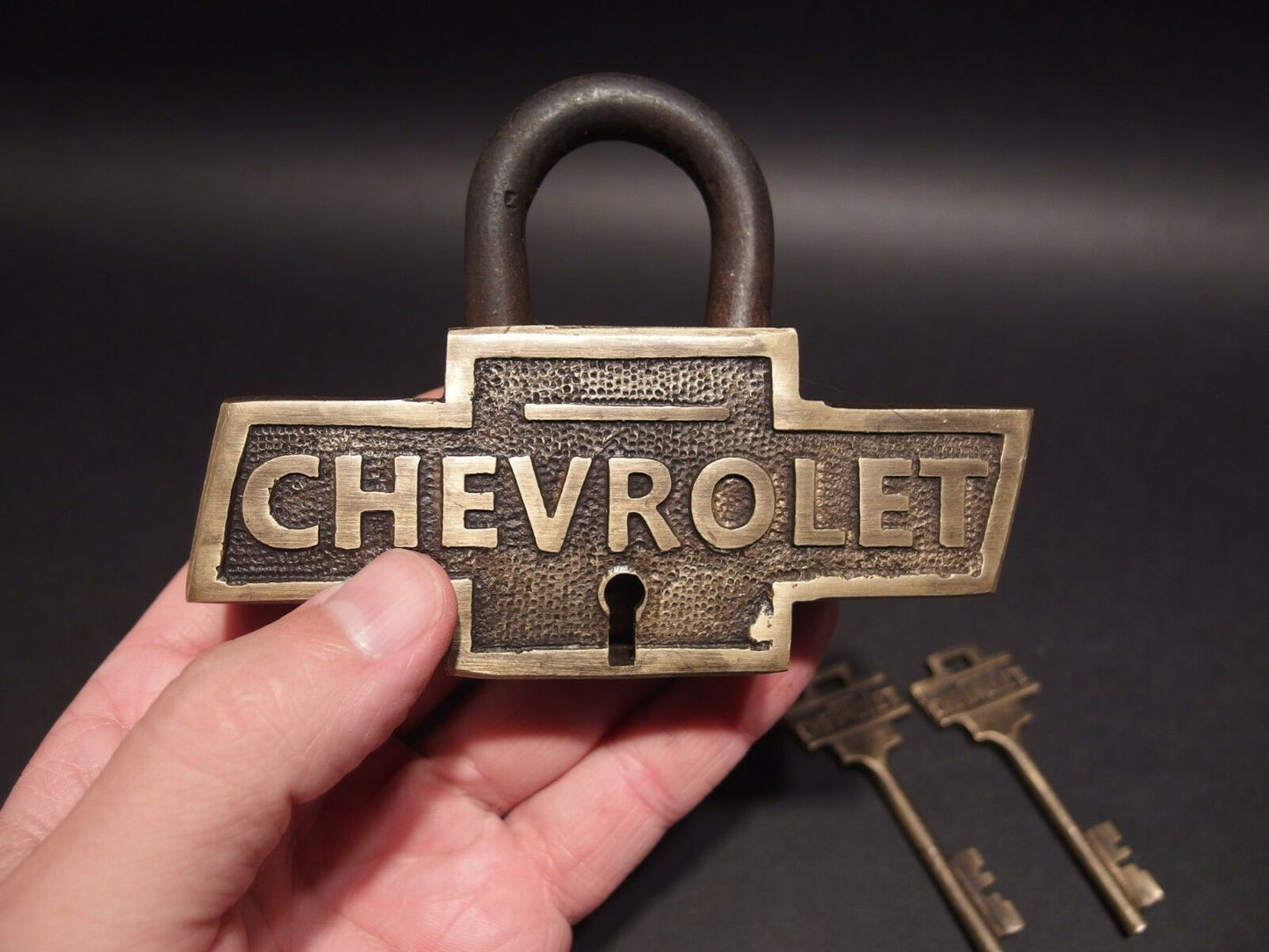 Sold at Auction: THREE PIECE BUICK AND CHEVROLET BRASS PAD LOCKS