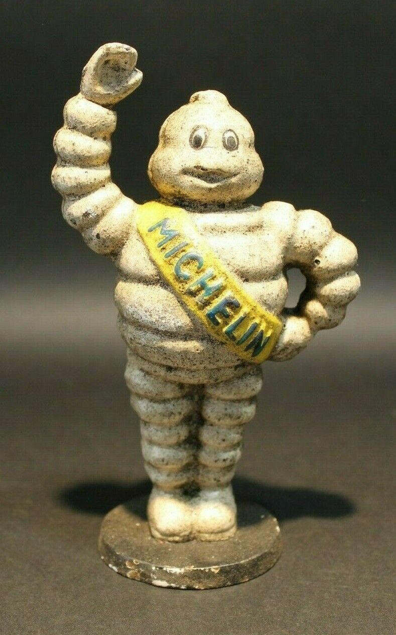 Vintage Style Cast Iron Coin Bank Tire Man - Early Home Decor