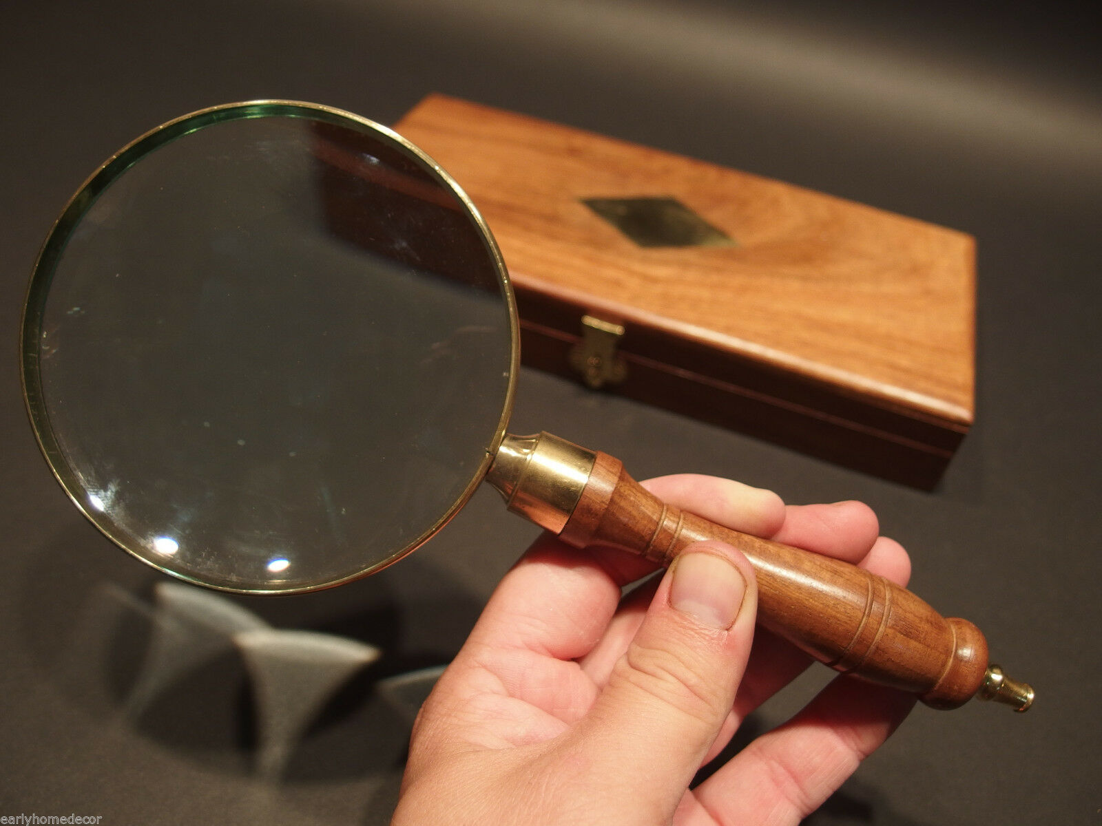 A wooden board and steel made vintage style magnifying glass, complete  handmade, made by artisians High