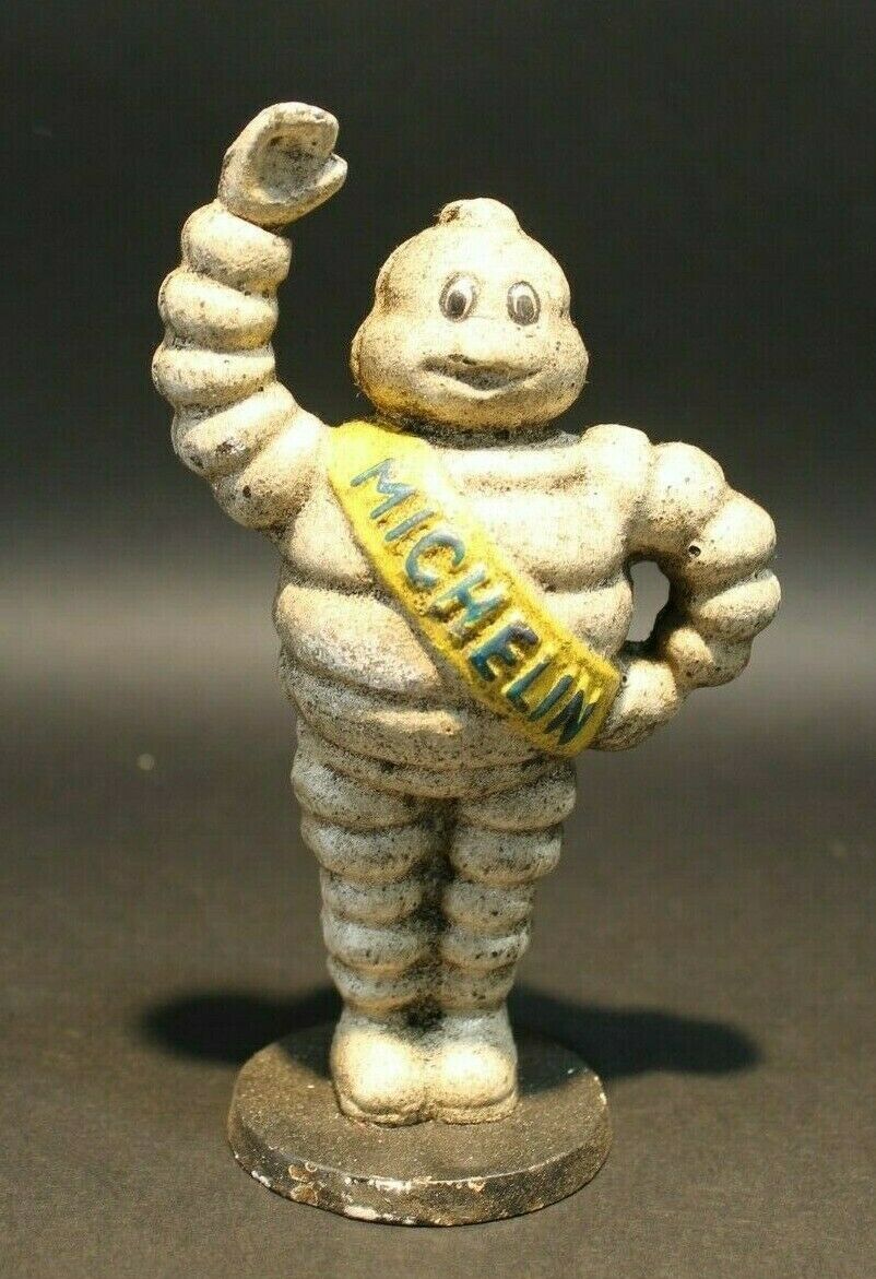 Vintage Style Cast Iron Coin Bank Tire Man - Early Home Decor